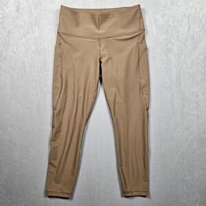 Athleta Interval Stash Lasercut 7/8 Tight Leggings Womens Brown Large Pockets